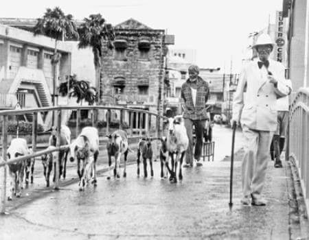 People crossing over the Charles Duncan O'Neale Bridge in Bridgetown